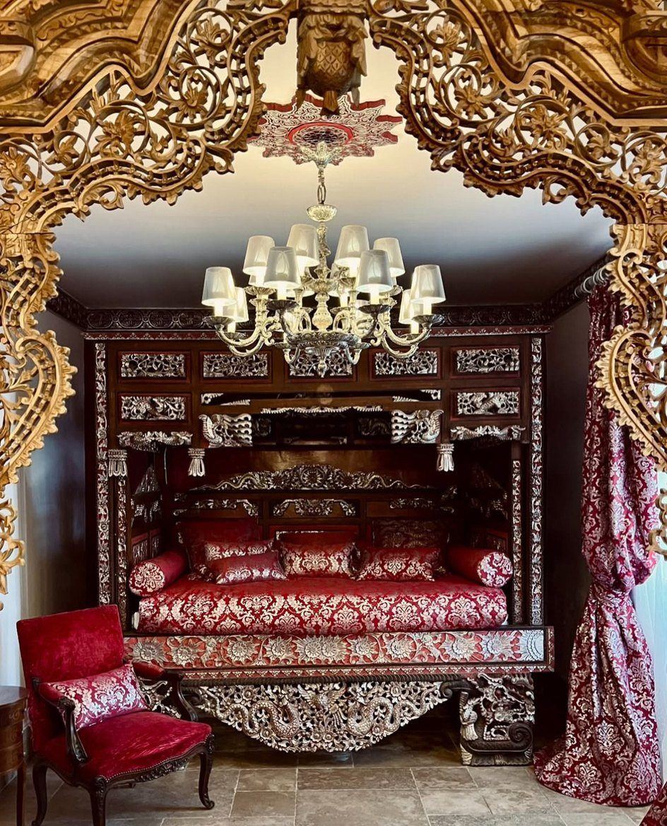 Bedroom in the house with a carved wooden bed