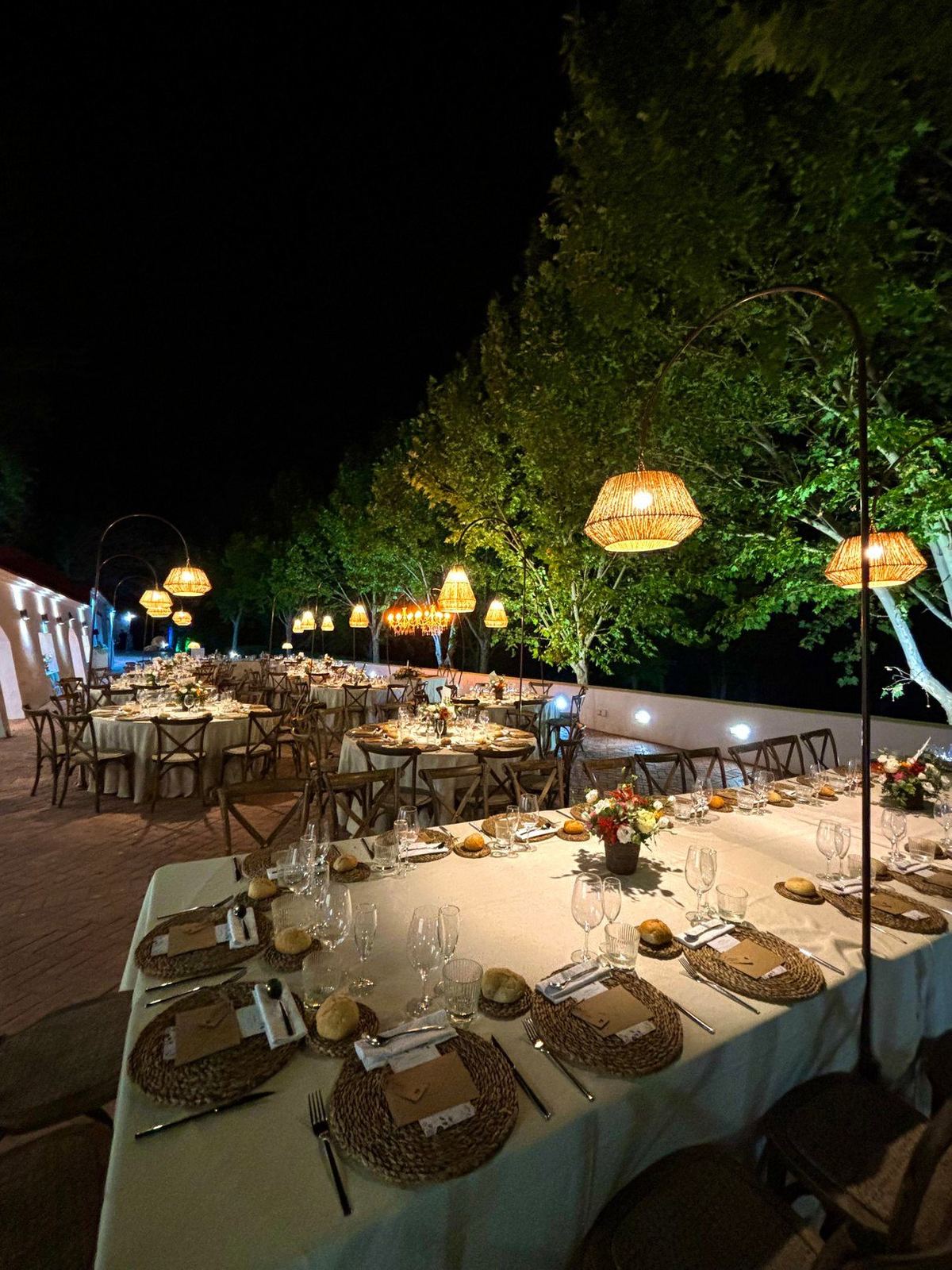 Tables lit by wicker lamps