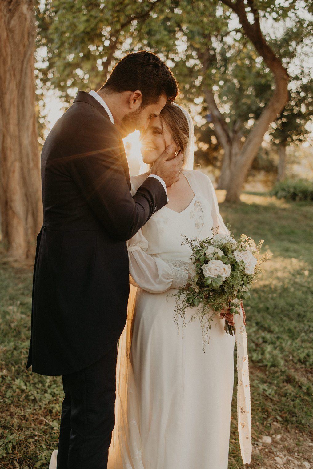 Couple at sunset under the trees